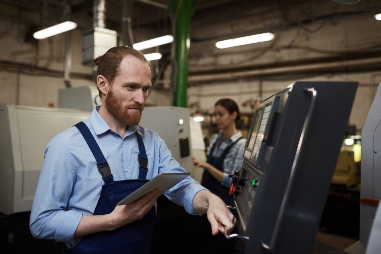 Engineer working on CNC machine